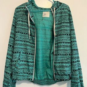 Teal patterned wind breaker